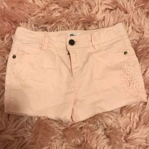 Light pink Jean shorts.
